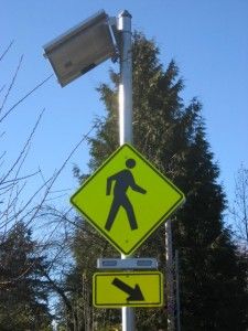 flashing pedestrian warning sign